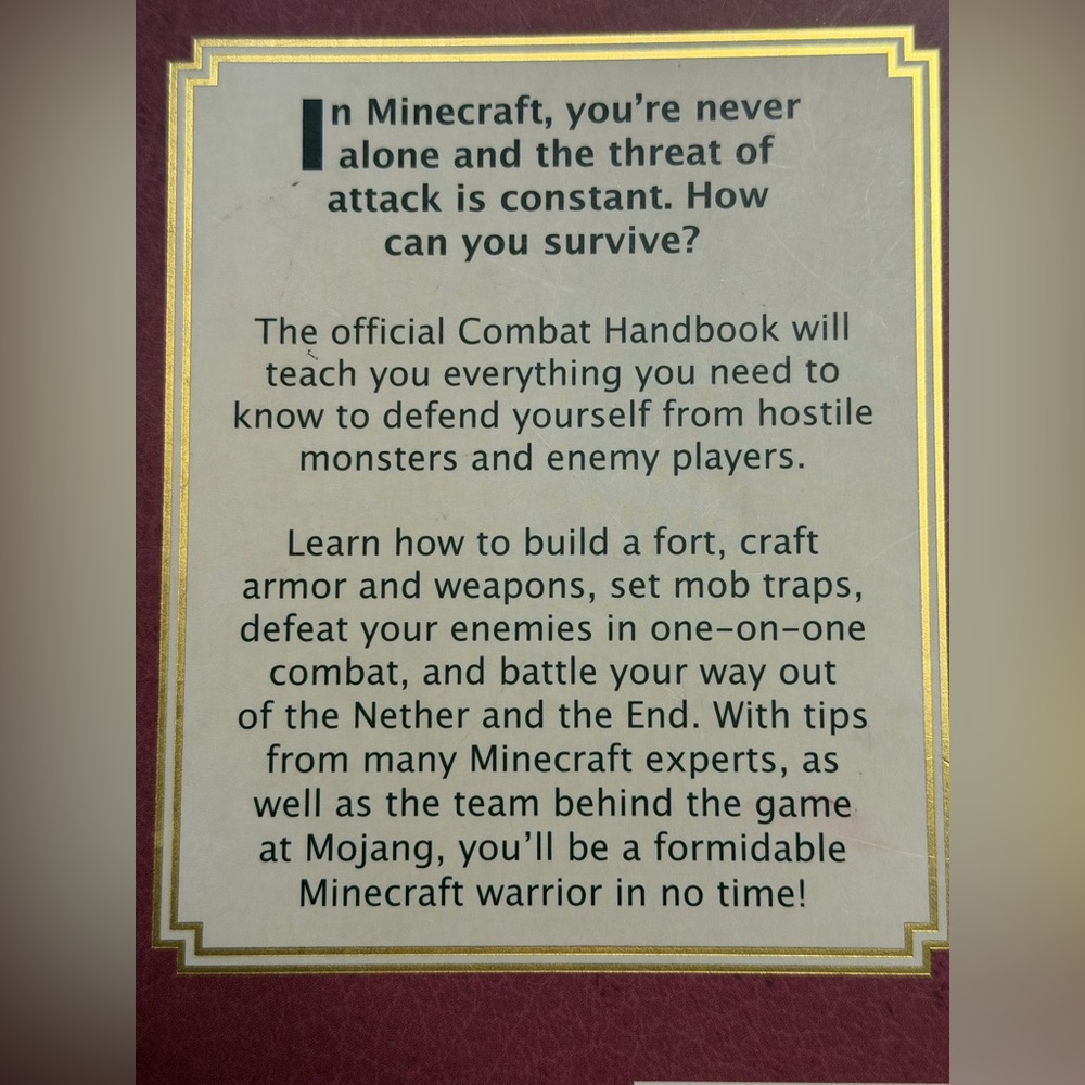 Minecraft Combat Handbook - Gold Sword on Burgundy Cover - Picture 2 of 4